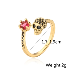 Macro detail of gothic skull ring with red ruby gemstone and black zircons