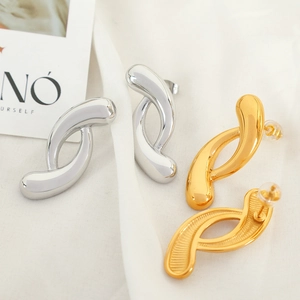 French style 18k gold and silver plated irregular geometric hoop earrings on white fabric