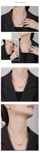 Model display featuring layered golden heart necklace with pearl pendant and stud earrings