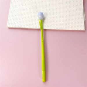 Detail of creative tulip gel pen with green stem and flower cap on pink background
