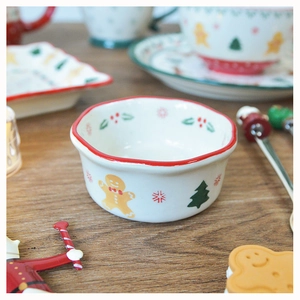 Close-up of a ceramic Christmas bowl with gingerbread man and snowflake patterns