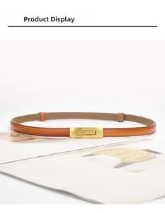 Close-up of brown leather waist belt with gold brushed metal buckle and fine stitching