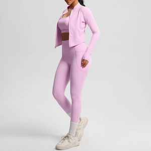 Three-piece pale pink yoga set featuring zip jacket, sports bra, and high-waist side pocket leggings