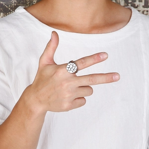Men's stainless steel ring with black and white geometric mosaic pattern on circular face