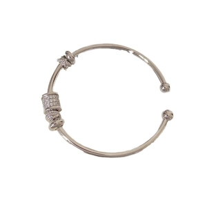 Minimalist silver cuff bangle with pavé-set crystal barrel bead and polished finish