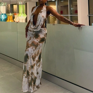 Detail of a deep V-neck halter maxi dress with earthy marble print and slim silhouette