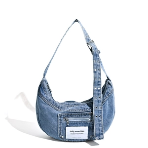 Vintage washed denim crossbody half-moon bag with adjustable eyelet shoulder strap