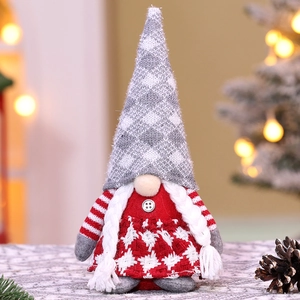 Macro detail of Christmas gnome figurine with grey plaid hat and white braided pigtails