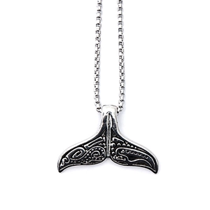 Vintage silver viking whale tail pendant necklace with engraved details on a chain