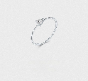 Macro shot of S925 sterling silver stamp and pear-shaped zircon on bubble textured ring