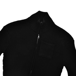 Close-up of black ribbed knit cardigan featuring a metal zipper and a square chest pocket
