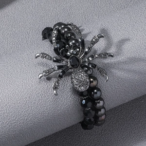 Gothic punk black beaded bracelet for men featuring a gunmetal spider with rhinestones