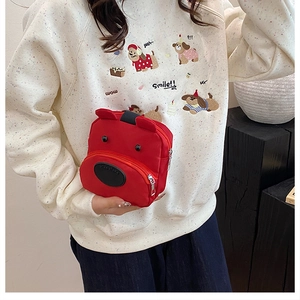 Detail of red cartoon bear mini wrist bag made of durable oxford cloth with zipper