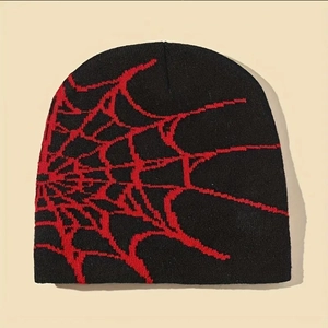 Close-up of black knitted beanie featuring a red spider web jacquard pattern detail