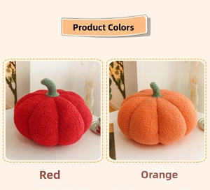 Detail of soft pumpkin pillows in red and orange sherpa fabric with green stems