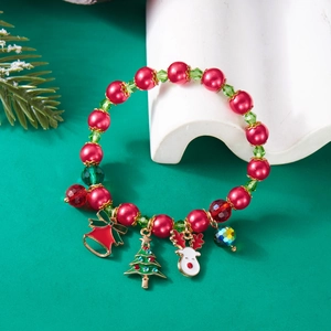 Christmas beaded bracelet with Santa charms, bells, and deer on a festive green background
