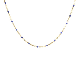 Detail shot of a minimalist gold chain necklace with delicate blue bead accents on white background