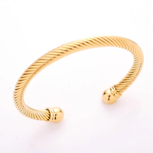 Mens gold twisted wire stainless steel bangle featuring spherical decorative ends