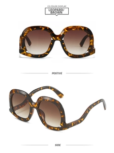 Front and side views of leopard print oversized sunglasses with gradient brown lenses