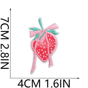 Detailed strawberry embroidery patch with size labels 7x4cm and pink bow decoration
