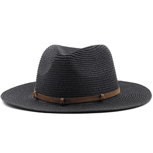Close-up of black straw woven cowboy hat with brown suede band and metal buckle detail