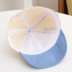 Detail of baby sun hat interior showing breathable mesh lining and reinforced seams