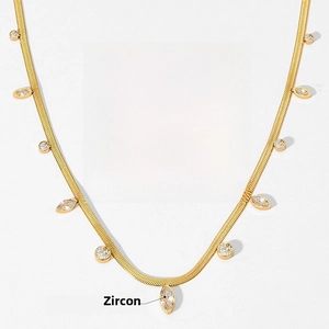 Detail of gold snake chain necklace showing 41+5cm length and clear zircon stones