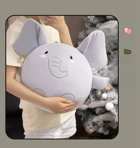Close-up of soft grey elephant plush pillow with cute embroidered expression and pink cheeks