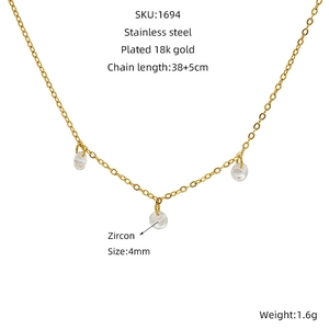 Macro shot of 18k gold plated stainless steel necklace with 4mm zircon pendants