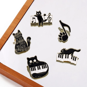 5-piece set of black cat and piano musical note enamel pins in black, white, and gold