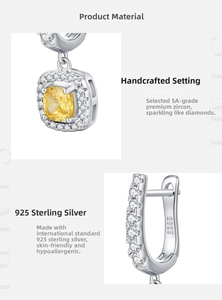 Macro shot of S925 sterling silver stamp and sparkling yellow cushion cut zircon stone