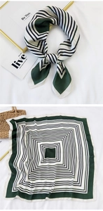 Detail of green and white geometric striped silk scarf shown tied and laid flat