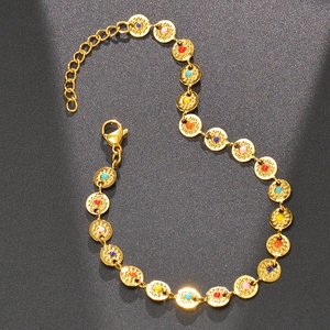Detailed close-up of golden stainless steel chain bracelet with colorful enamel round charms
