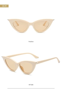 Beige cat eye sunglasses with light orange lenses and silver stud details on frame