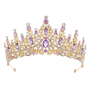 Close-up of royal crown showing purple and white crystals on golden alloy frame