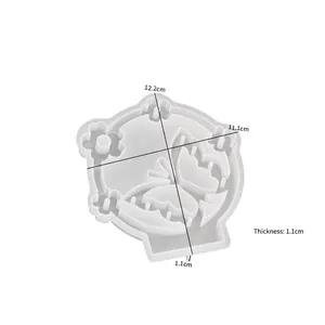 Detail of butterfly and floral silicone candle holder mold with 12.2x11.1cm dimensions