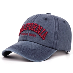 Detail of red 3D California embroidery on washed denim vintage baseball cap surface