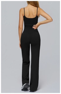 Back view of black yoga set featuring a slim camisole top and high waist wide leg pants