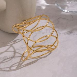 Modern 18K gold plated stainless steel wide cuff bracelet with layered oval design