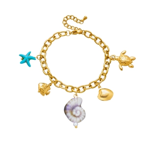 Detail view of gold ocean charms including starfish, turtle, fish and shells on a chain