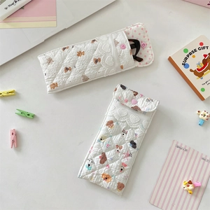 Quilted white storage pouch with cute dog and bear prints featuring lace trim details