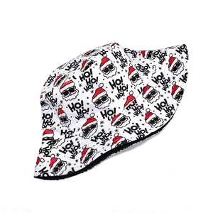 Detail of Christmas bucket hat showing Santa prints and reversible black lining fabric