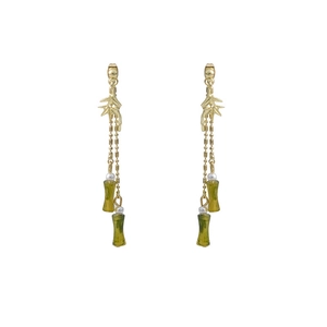 Long gold tassel earrings with green bamboo-shaped pendants and hollow flower design