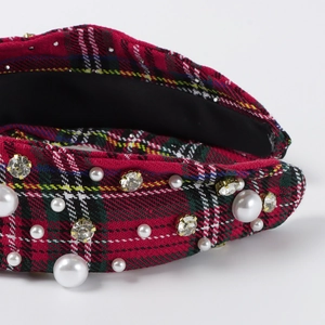 Detailed close-up of red and green plaid headband featuring imitation pearls and crystals