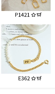 Detailed shot of golden chain earrings and a pearl bracelet set with a square charm