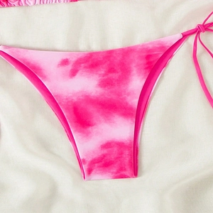 Detail of bright pink tie-dye bikini bottoms with adjustable side tie strings