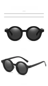 Front and 45-degree side view of matte black round frame sunglasses for kids