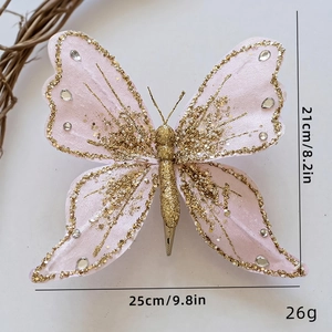 Detailed view of pink artificial butterfly decoration with gold glitter and rhinestones