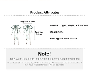 Detailed view of green beaded tassel earrings showing length and width measurements