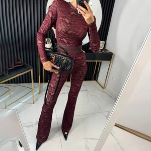 Detailed view of burgundy lace patchwork long sleeve bodysuit with matching waist belt